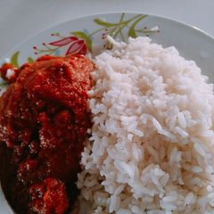 A picture of Rice and chicken stew.