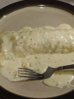 A picture of Jalapeno & Sausage stuffed Enchiladas in Alfredo Sauce.
