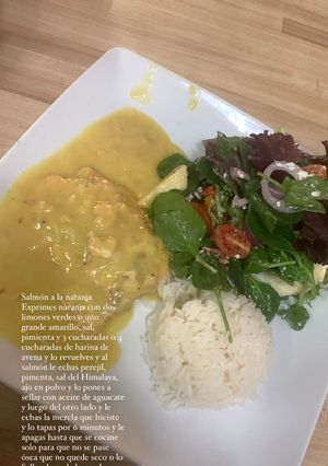 A picture of Orange Salmon with Salad and White Rice.