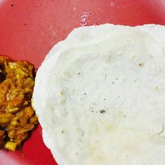 Malabar chiken curry and pathiri. (kerala style) A picture of Malabar chiken curry and pathiri. (kerala style).
