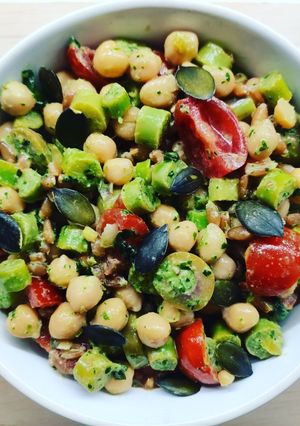 A picture of Farro Salad with Chickpeas, Olives, and Walnut Basil Pesto.
