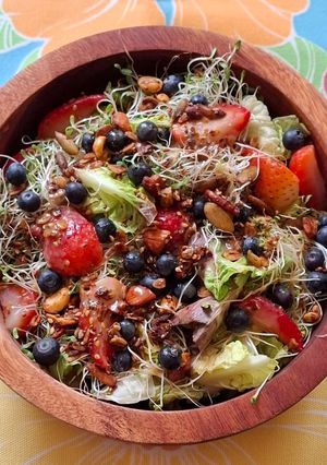 A picture of Green Salad with Strawberries, Blueberries, and Savory Granola.