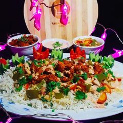 A picture of Spicy BBQ chicken ricewith stir fry vegetables.