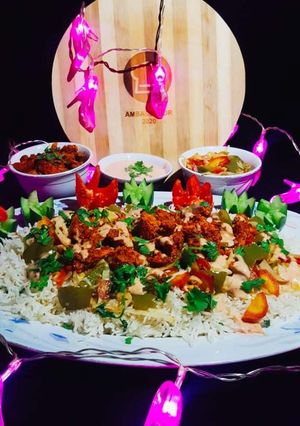 A picture of Spicy BBQ chicken ricewith stir fry vegetables.