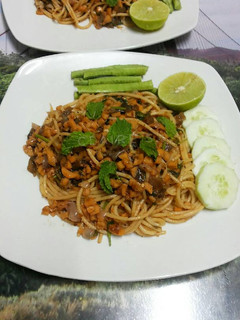 A picture of Thai Style LARB Spaghetti with Mushroom and Sausages.