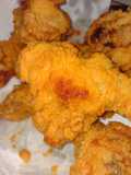 Alitas de pollo enharinada