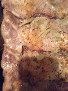 A picture of Bake pork steak with onions .