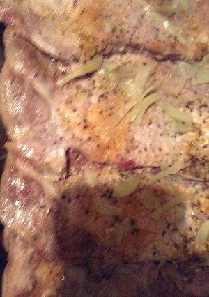 A picture of Bake pork steak with onions .