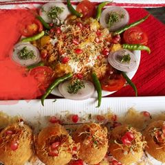 A picture of Potato Tikki Choke Chaat with Dry Pani puri.