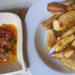 A picture of Fried sweet potatoes with Tomatoes sauce.