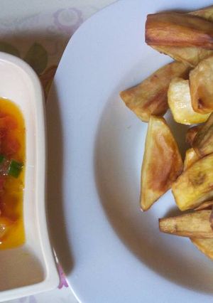 A picture of Fried sweet potatoes with Tomatoes sauce.