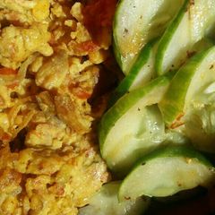 Scrambled eggs and stir fried cucumber A picture of Scrambled eggs and stir fried cucumber.