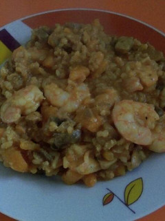 Una foto de Risotto de boletus, calabaza y gambas