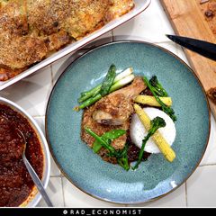 A picture of Ofada stew & breaded oven baked chicken.