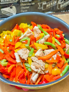 A picture of Stir-Fried Chicken Breast with Bell Peppers and Green Beans.