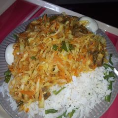A picture of White rice with liver and veggies.