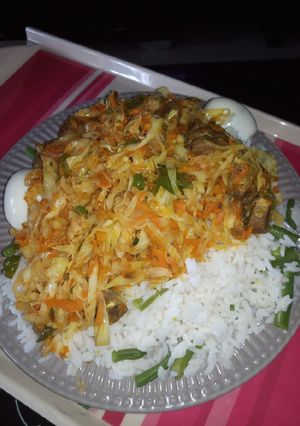 A picture of White rice with liver and veggies.