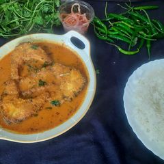 A picture of Rohu fish curry.