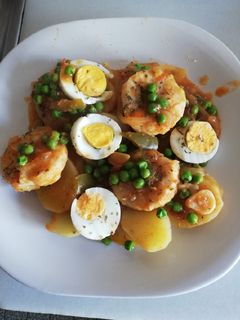 Una foto de Medallones de Merluza al horno con guisantes