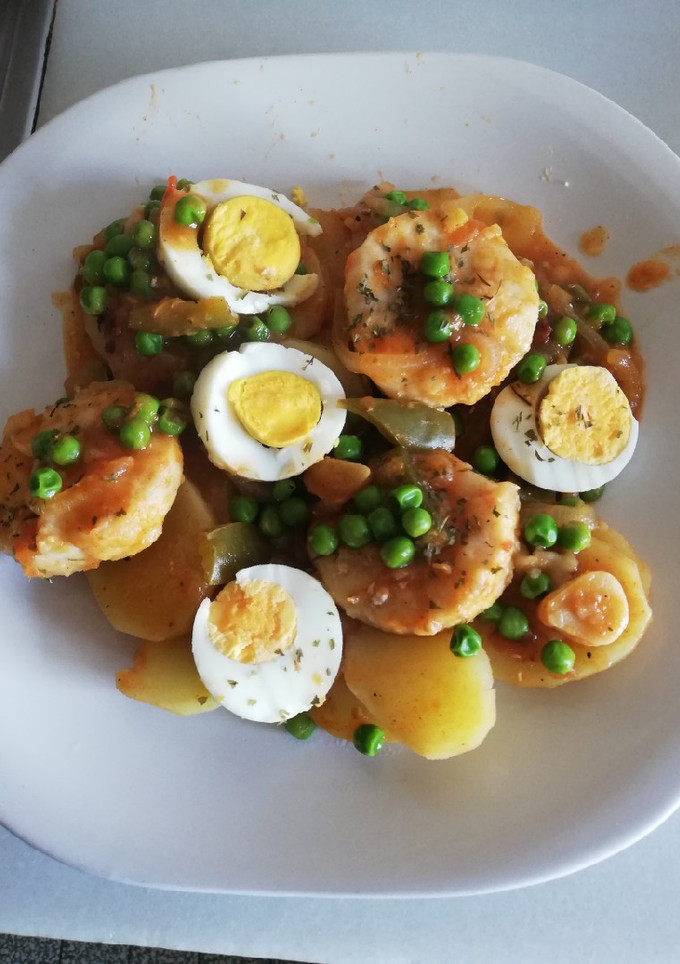 Una foto de Medallones de Merluza al horno con guisantes
