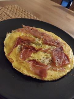 Una foto de 🍕 Tortipizza de jamón y tomate