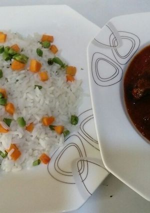 A picture of Veggie Basmatti white Rice and Goatmeat Stew.