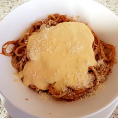 A picture of My Quick Spaghetti in tomato juice and homemade Cheese sauce.😀.