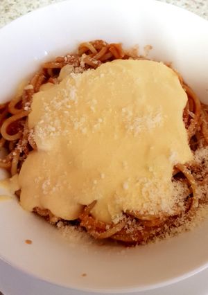 A picture of My Quick Spaghetti in tomato juice and homemade Cheese sauce.😀.
