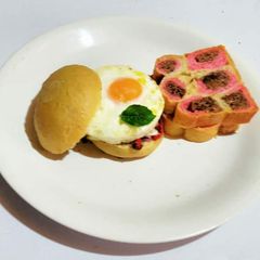 A picture of Paw Bread and Steamed fried Sunny Side Up.