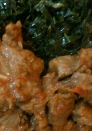 A picture of Wet-fried beef and sukumawiki.