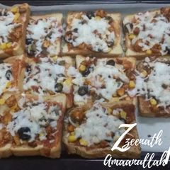 Oven Baked Chicken Loaded Bread Pizzas A picture of Oven Baked Chicken Loaded Bread Pizzas.