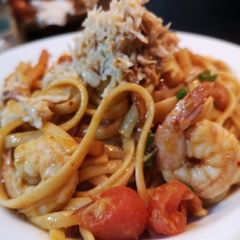 A picture of Korean chilli flakes, garlic, soy, prawn and crab linguine.