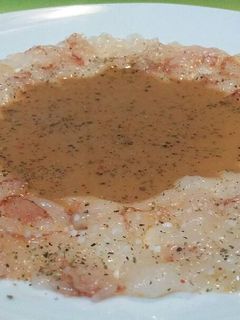 Una foto de Carpaccio de gambón