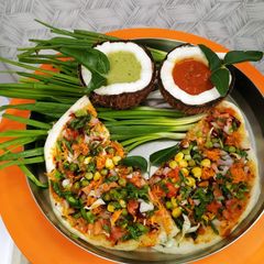 A picture of Veg Dosa wth Coconut CHUTNEY.
