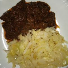 A picture of WET FRIED LIVER* SAUTÉED *CABBAGE*UGALI.