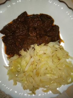 A picture of WET FRIED LIVER* SAUTÉED *CABBAGE*UGALI.