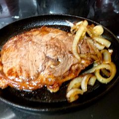 A picture of My Quick Fry Sirloin Steak with onions.