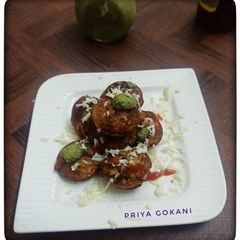 3 in 1 Pizza Flavor Rava Appe topped with Cheese, Chutney and Ketchup A picture of 3 in 1 Pizza Flavor Rava Appe topped with Cheese, Chutney and Ketchup.
