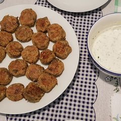 A picture of Aubergine balls aka Melitzanokeftedes in the oven.