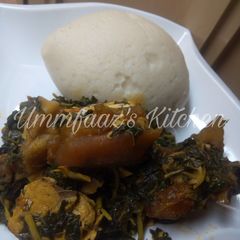 A picture of Tuwo and eforiro soup.