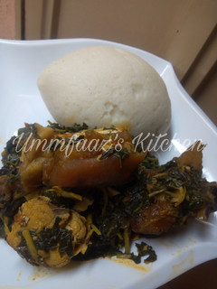 A picture of Tuwo and eforiro soup.