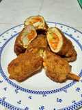 Milanesa de pollo empanizado relleno de verduras