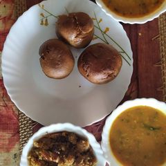 A picture of Daal, bati and churma.