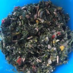 A picture of Spinach with tuna fish.