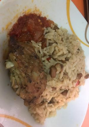 A picture of Rice and Beans with Chicken Stew.