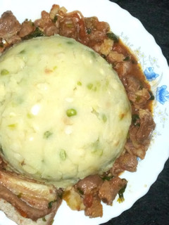 A picture of Mukimo/ beef stew.