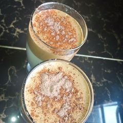 A picture of Dalgona coffee with cocoa powder.