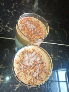A picture of Dalgona coffee with cocoa powder.