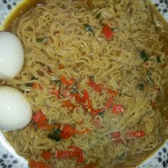 A picture of Indomie noodles with eggs.