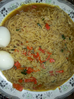 A picture of Indomie noodles with eggs.